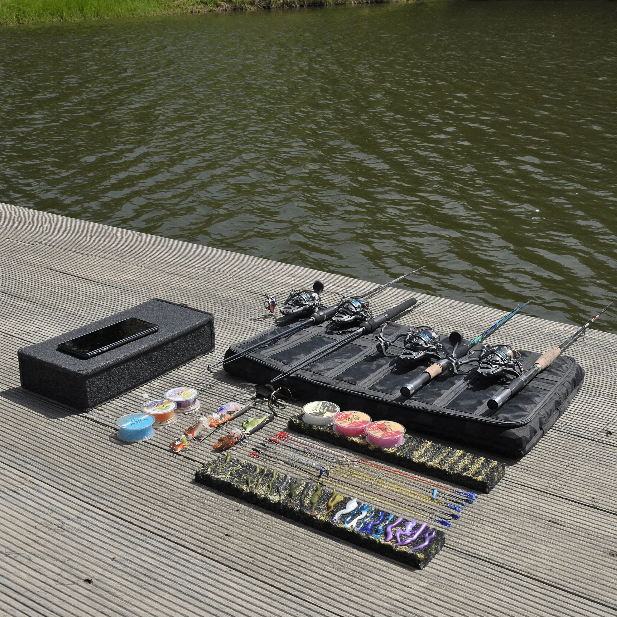 Photorealistic rods reels and bass tackle on a dock