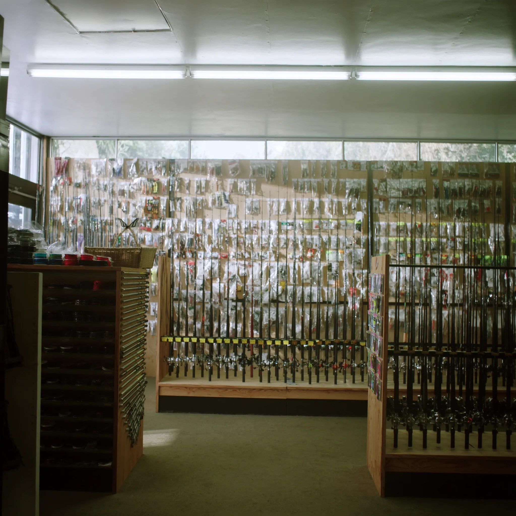 Photorealistic bass tackle shop with rods reels and lures