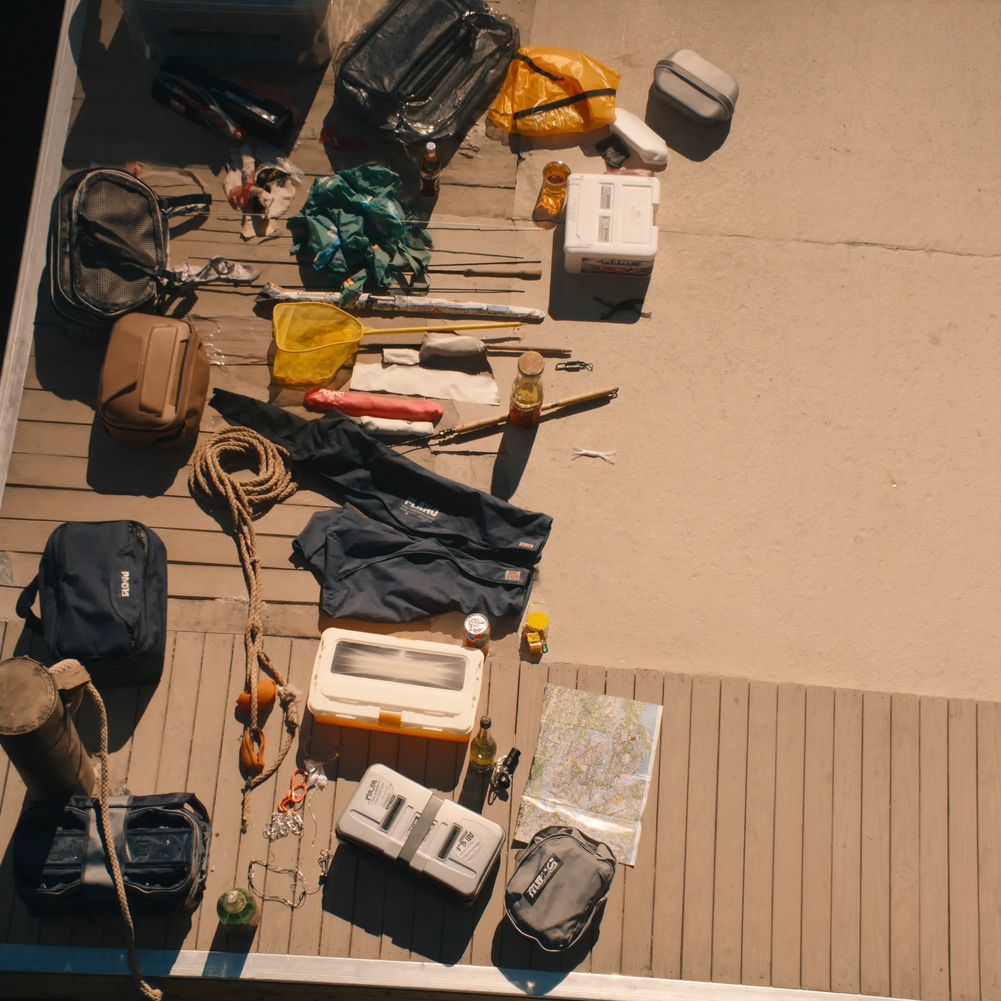 Photorealistic fishing trip package gear on a dock beside a bass boat